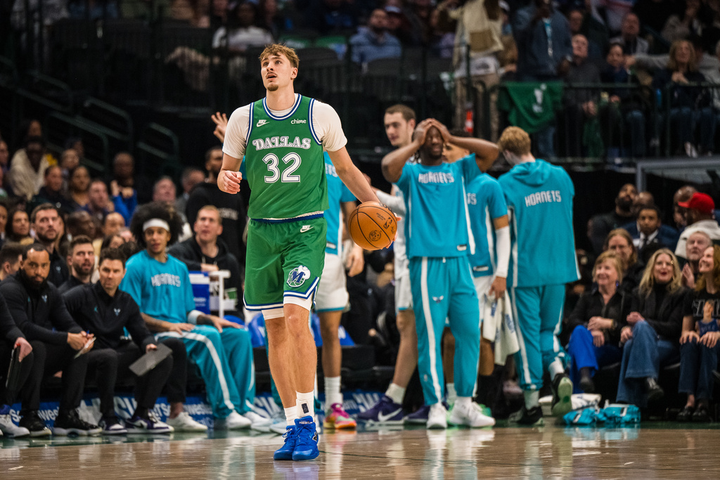 Dallas Mavericks forward Cooper Flagg dribbles the ball during an NBA basketball game against the Charlotte Hornets, Thursday, Jan. 29, 2026, in Dallas. (AP Photo/Jessica Tobias)