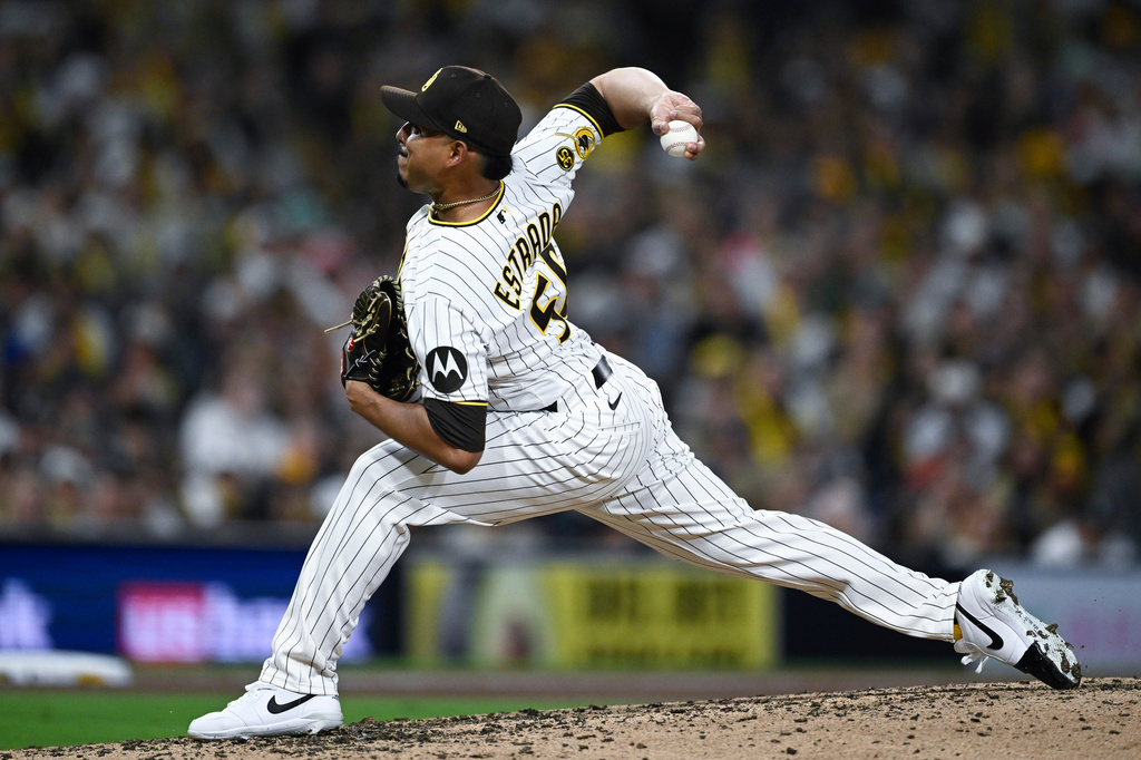 San Diego Padres relief pitcher Jeremiah Estrada delivers during the seventh inning of a baseball game against the Detroit Tigers, Friday, March 27, 2026, in San Diego. (AP Photo/Denis Poroy)