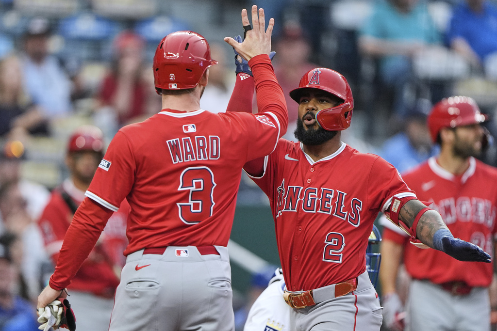 Los Angeles Angels' Luis Rengifo (2) celebrates with Taylor Ward (3) after hitting a three-run home run during the first inning of a baseball game against the Kansas City Royals, Thursday, Sept. 4, 2025, in Kansas City, Mo. (AP Photo/Charlie Riedel)