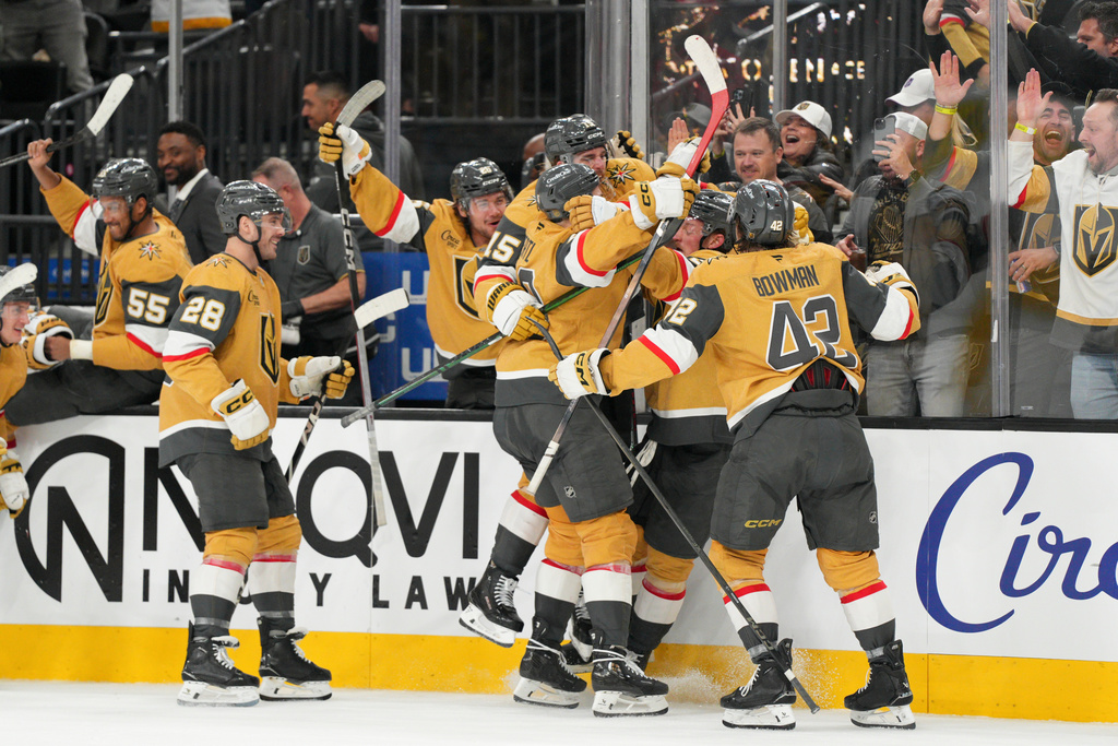 Vegas Golden Knights center Jack Eichel (9) and teammates celebrate his goal against the Toronto Maple Leafs during overtime of an NHL hockey game Thursday, Jan. 15, 2026, in Las Vegas. (AP Photo/Candice Ward)