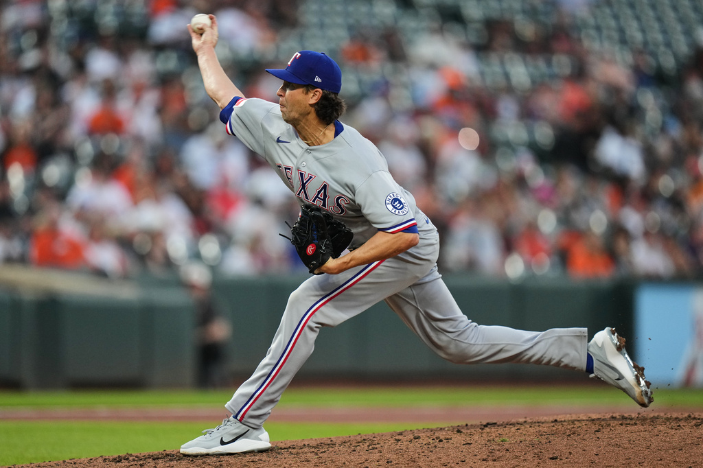 Texas Rangers starting pitcher Jacob deGrom delivers during the second inning of a baseball game against the Baltimore Orioles, Tuesday, March 31, 2026, in Baltimore. (AP Photo/Stephanie Scarbrough)