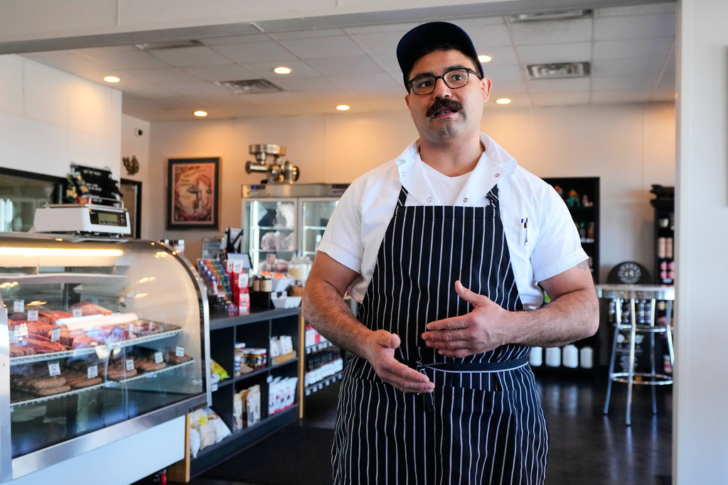 Nate Abeyta, owner and founder of Deep Cuts butcher shop responds to a question during an interview at his shop, Tuesday, Oct. 21, 2025, in Dallas. (AP Photo/Tony Gutierrez)