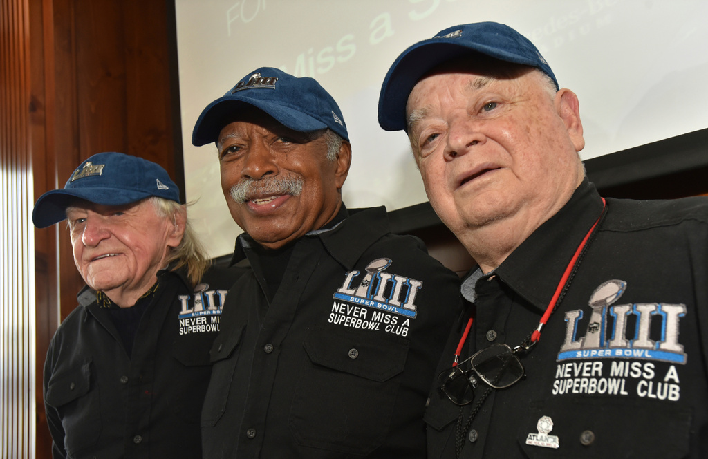 FILE — Members of the Never Miss a Super Bowl Club, from the left, Tom Henschel, Gregory Eaton, and Don Crisman pose for a group photograph during a welcome luncheon, in Atlanta, Feb. 1, 2019. (Hyosub Shin/Atlanta Journal-Constitution via AP, File)