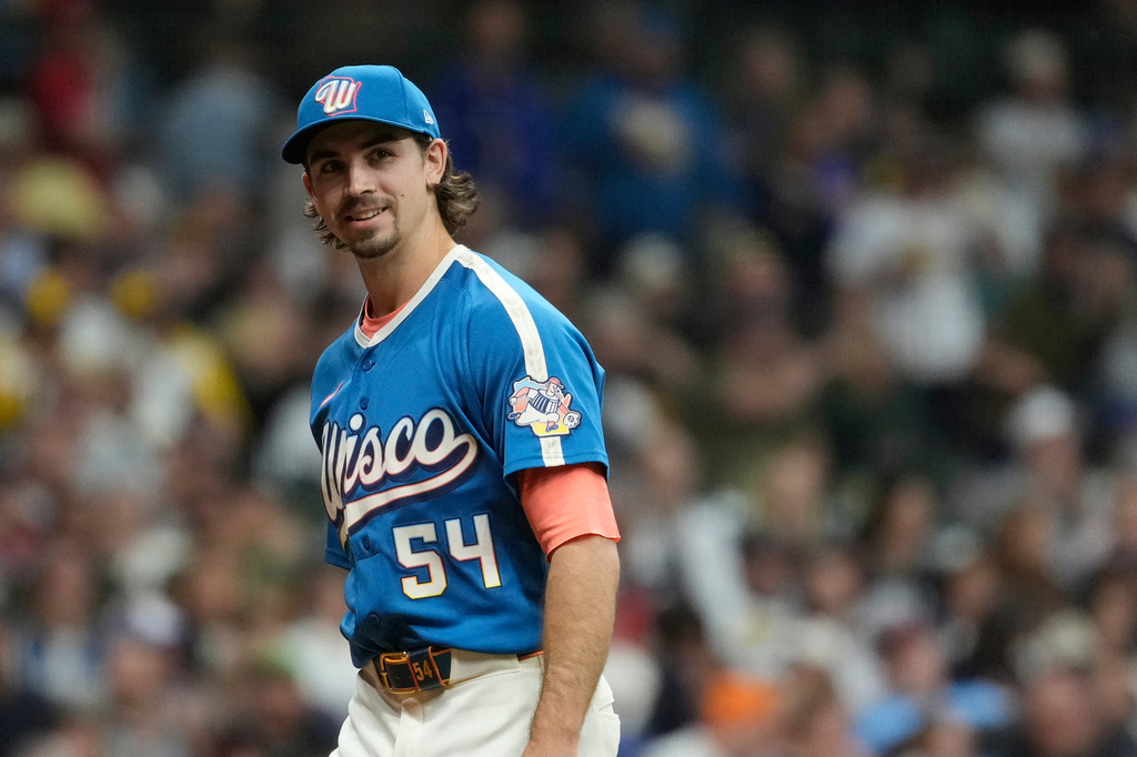 Milwaukee Brewers' Robert Gasser smiles as he walks to the dugout during the second inning of a baseball game against the St. Louis Cardinals, Friday, Sept. 25, 2026, in Milwaukee. (AP Photo/Aaron Gash)