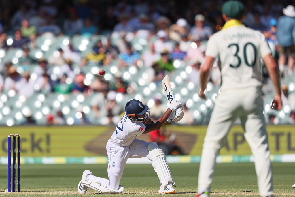 England's Jofra Archer plays a shot during play on day two of the third Ashes cricket test between England and Australia in Adelaide, Australia, Thursday, Dec. 18, 2025. (AP Photo/James Elsby)