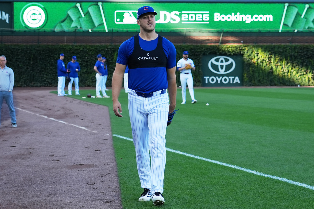 Chicago Cubs pitcher Jameson Taillon walks to the dugout during batting practice, Tuesday, Oct. 7, 2025, in Chicago, the day before Game 3 of the National League Division Series against the Milwaukee Brewers. (AP Photo/Nam Y. Huh)
