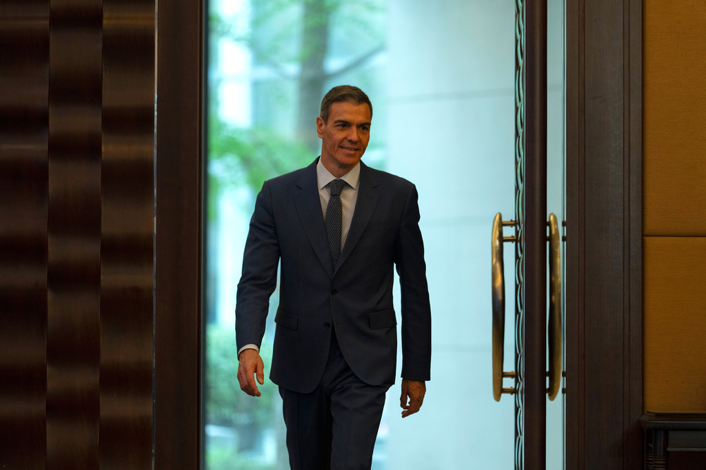 Spain's Prime Minister Pedro Sanchez arrives for a press conference in Beijing, China, Tuesday, April 14, 2026. (AP Photo/Ng Han Guan)
