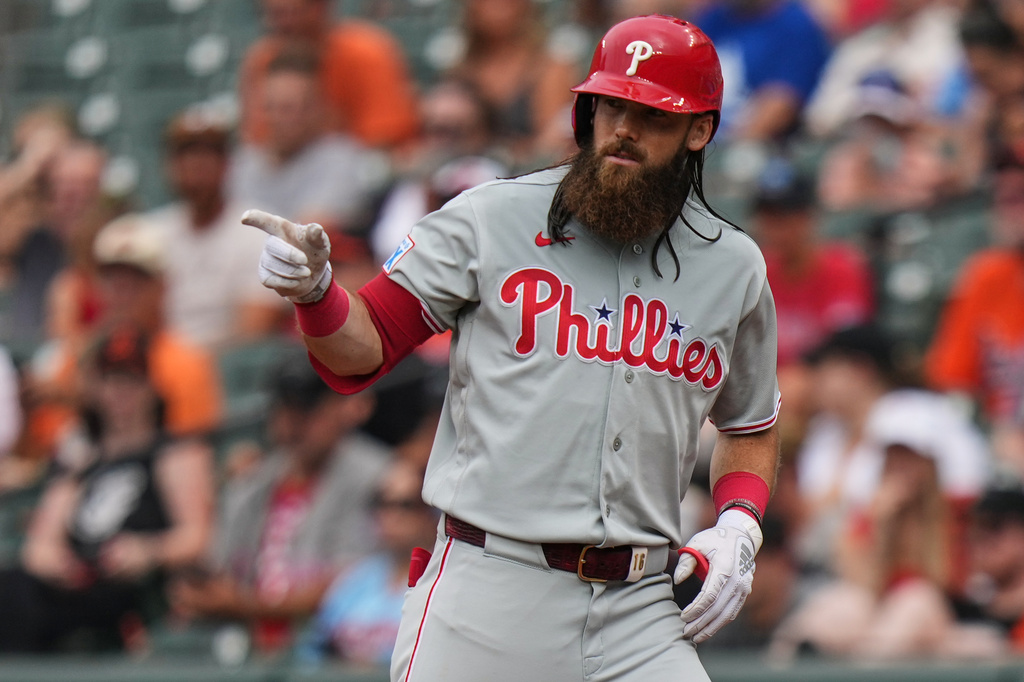 Philadelphia Phillies' Brandon Marsh reacts after J.T. Realmuto draws a walk against Baltimore Orioles pitcher Anthony Nunez to advance the runners on base during the fourth inning of a baseball game, Sunday, Aug. 2, 2026, in Baltimore. (AP Photo/Stephanie Scarbrough)