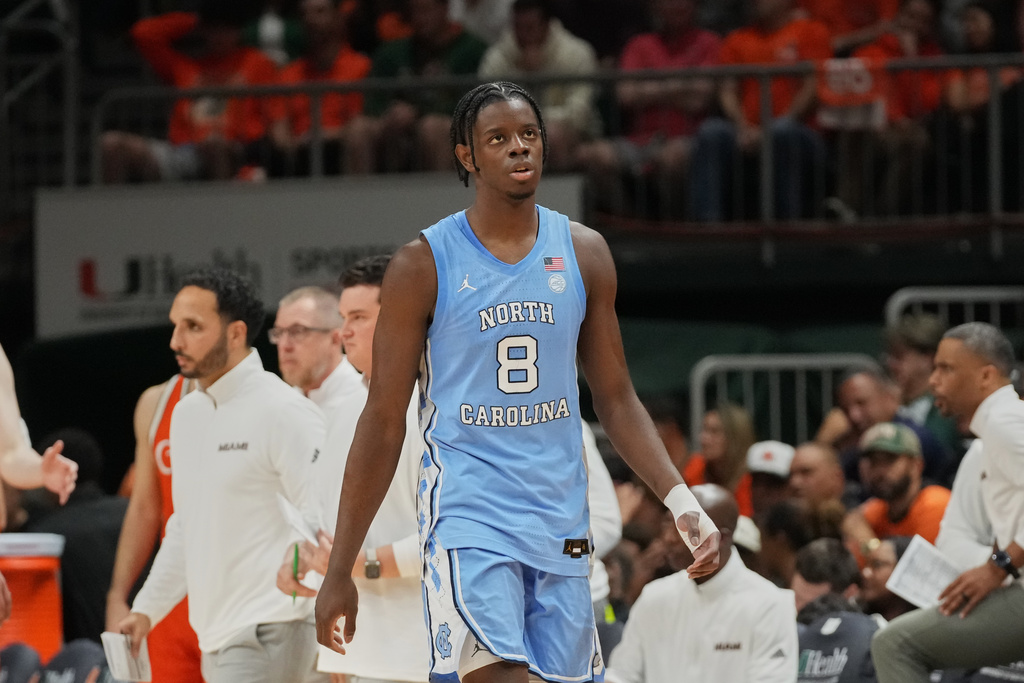 FILE - North Carolina forward Caleb Wilson (8), his left hand in a bandage, walks back to the bench during the second half of an NCAA college basketball game against Miami, Tuesday, Feb. 10, 2026, in Coral Gables, Fla. (AP Photo/Marta Lavandier, File)