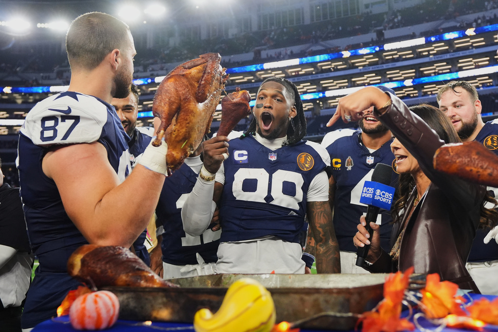 Dallas Cowboys wide receiver CeeDee Lamb (88) and tight end Jake Ferguson (87) celebrate following an NFL football game against the Kansas City Chiefs Thursday, Nov. 27, 2025, in Arlington, Texas. (AP Photo/LM Otero)