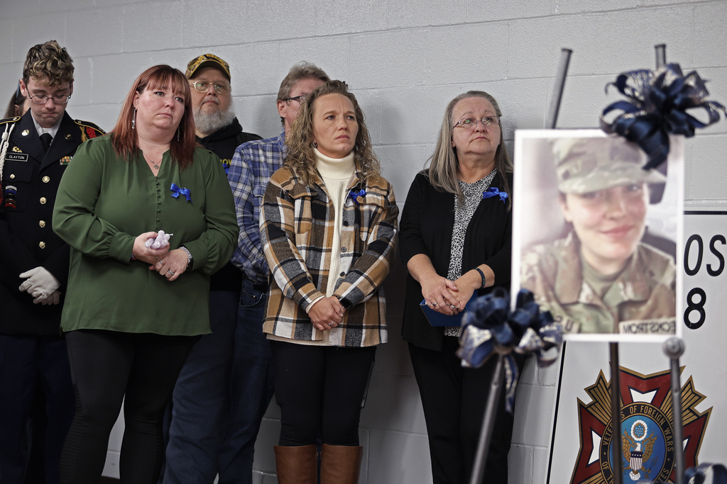 People gather for a vigil in honor of National Guard member Specialist Sarah Beckstrom, one of two National Guard members who were shot in Washington on Wednesday, in Webster Springs, W.Va., Friday, Nov. 28, 2025. (AP Photo/Kathleen Batten)
