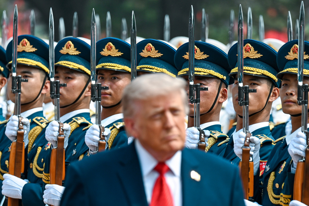 President Donald Trump reviews troops at the Great Hall of the People, Thursday, May 14, 2026, in Beijing. (Kenny Holston/The New York Times via AP, Pool)
