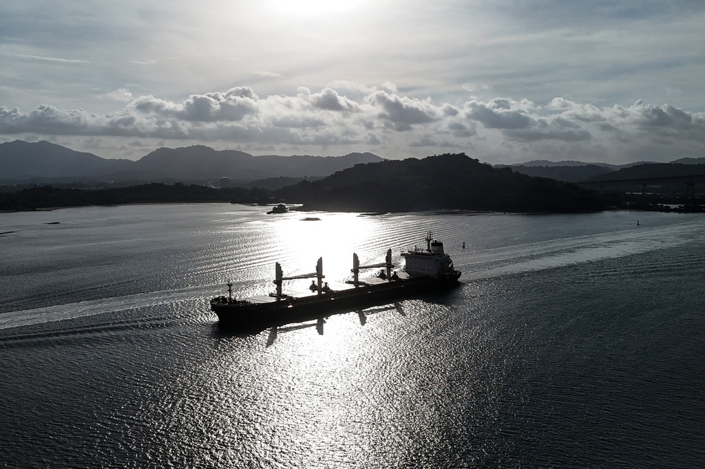 A cargo ship transits the Panama Canal after authorities announced a reduction to daily transits due to forecasts of El Niño conditions in Panama City, Friday, July 24, 2026. (AP Photo/Matias Delacroix)
