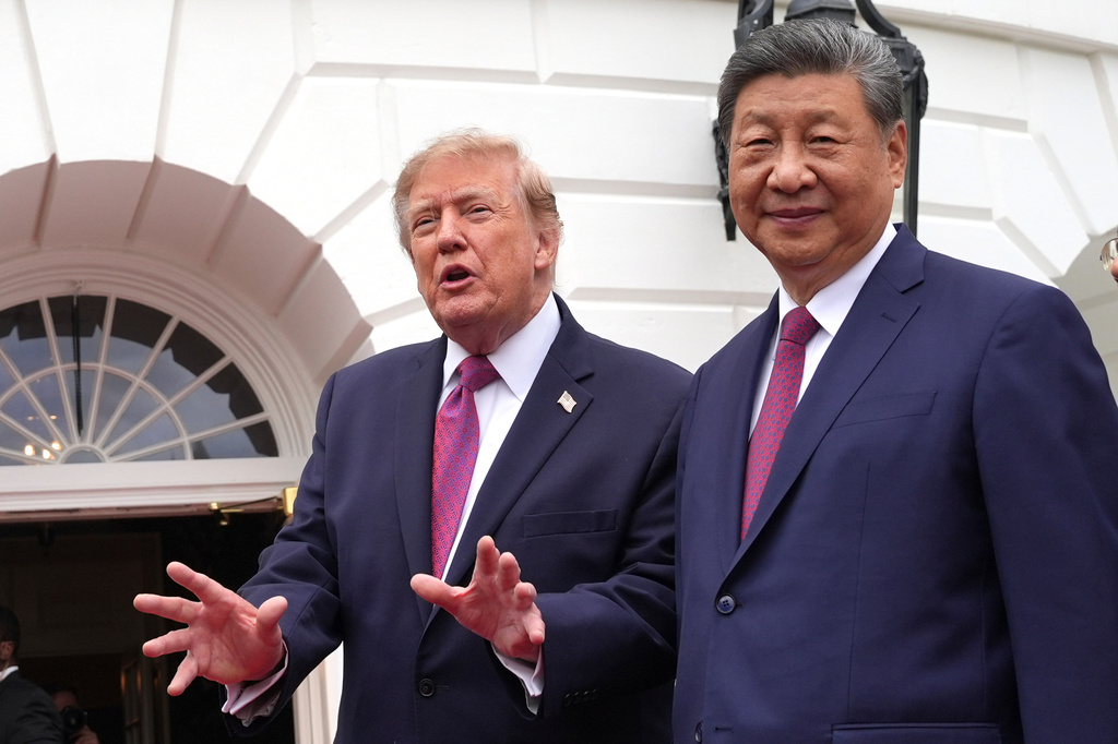 President Donald Trump, left, speaks to reporters during a tour of the South Lawn of the White House with China's President Xi Jinping, right, Thursday, Sept. 24, 2026, in Washington. (AP Photo/Alex Brandon)