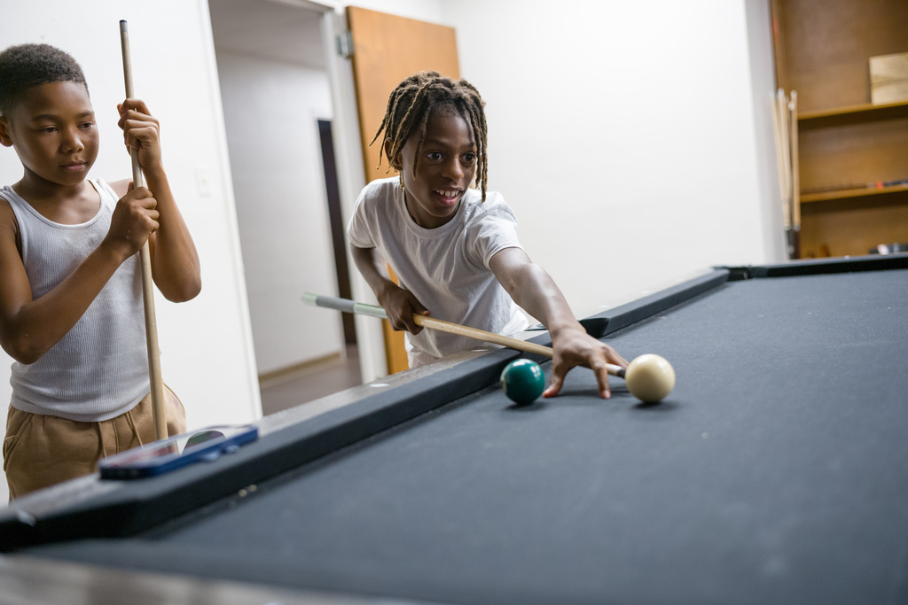 Kids play pool after school at Youth Opportunities Development in Clairton, Pa., on Tuesday, Oct. 7, 2025. (Quinn Glabicki/Pittsburgh's Public Source via AP)