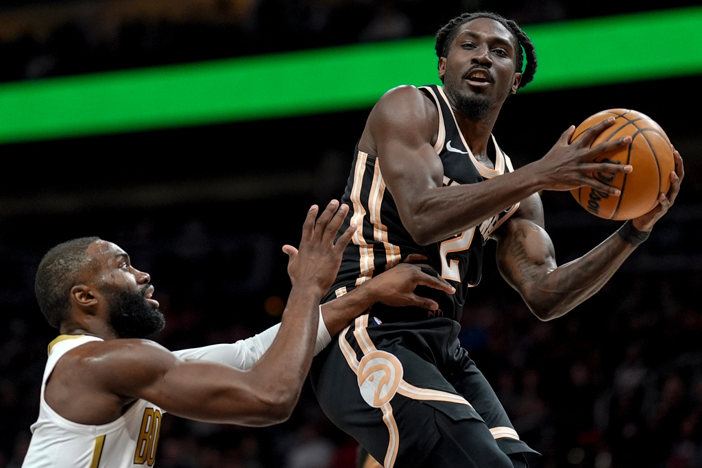Atlanta Hawks guard Keaton Wallace (2) shoots against the Boston Celtics during the first half of an NBA basketball game, Saturday, Jan. 17, 2026, in Atlanta. (AP Photo/Mike Stewart)