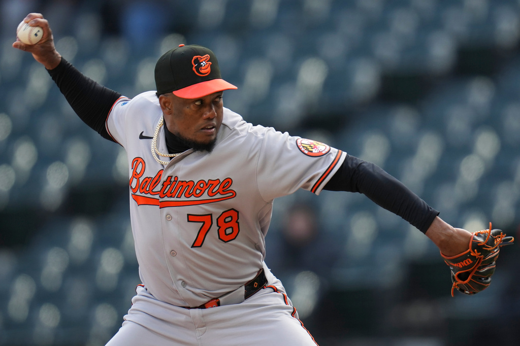 Baltimore Orioles pitcher Yennier Cano (78) throws against the Chicago White Sox during the seventh inning of a baseball game, Tuesday, April 7, 2026, in Chicago. (AP Photo/Erin Hooley)