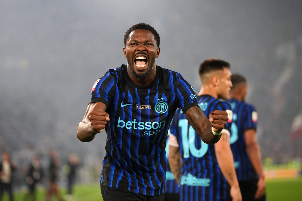 Inter Milan's Marcus Thuram celebrates after Lazio's Adam Marusic scored an own goal during the Italian Cup soccer final between Lazio and Inter Milan, in Rome, Wednesday, May 13, 2026. (AP Photo/Andrew Medichini)