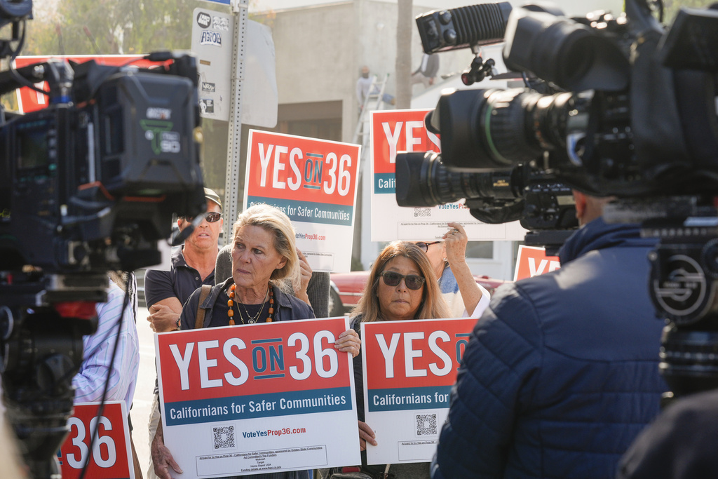 FILE - Neighbors and local business owners join in to support California's Proposition 36 on the November ballot at a news conference in the Venice neighborhood of Los Angeles on Monday, Sept. 30, 2024. (AP Photo/Damian Dovarganes, File)