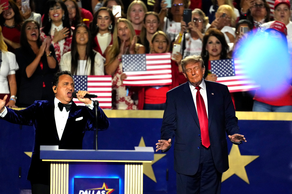 President Donald Trump listens while Christopher Macchio, Presidential Tenor performs at the Republican convention, Thursday, Sept. 10, 2026, in Dallas. (AP Photo/Tony Gutierrez)