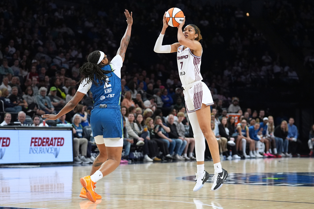 Toronto Tempo forward Teonni Key (7) shoots over Minnesota Lynx forward Liatu King (2) during the second half of a WNBA basketball game Thursday, May 21, 2026, in Minneapolis. (AP Photo/Abbie Parr)