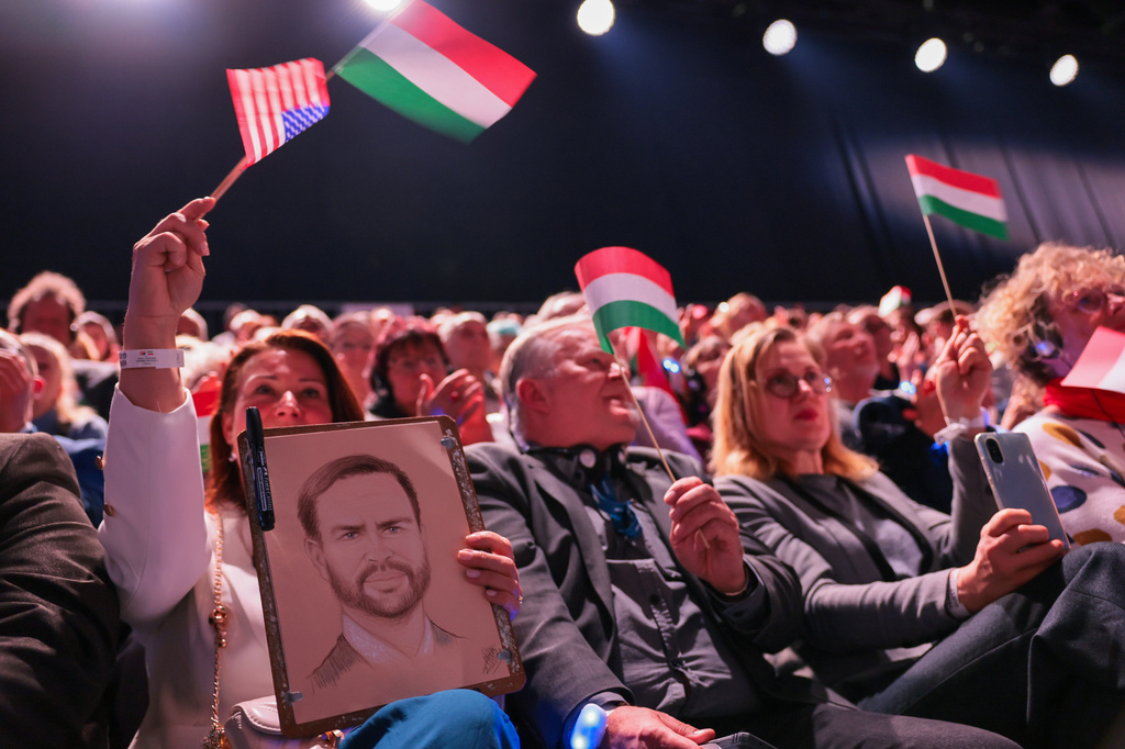 A member of the audience holds a portrait of U.S. Vice President JD Vance during a Day of Friendship event held by Vance and Hungarian Prime Minister Viktor Orban, in Budapest, Hungary Tuesday, April 7, 2026. (Jonathan Ernst/Pool Photo via AP)