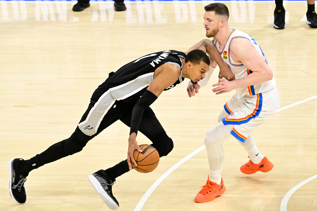 San Antonio Spurs forward Victor Wembanyama (1) moves against the Oklahoma City Thunder in the second half of Game 5 in the Western Conference finals NBA basketball playoffs series, Tuesday, May 26, 2026, in Oklahoma City. (AP Photo/Gerald Leong)