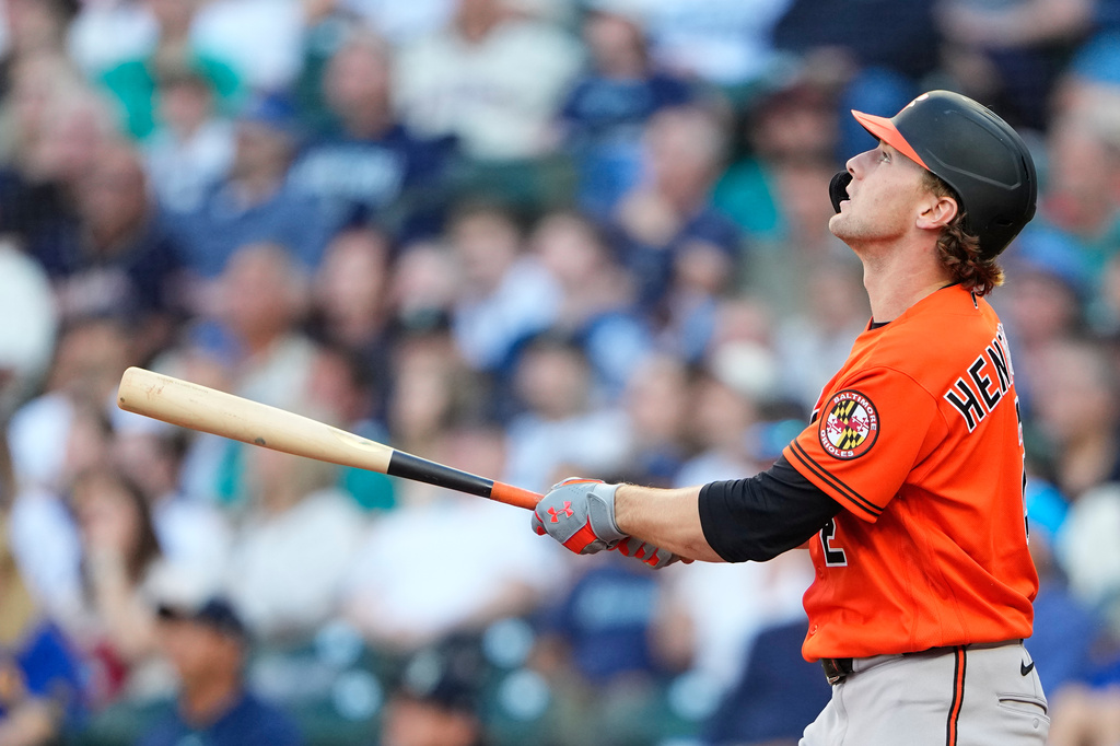 Baltimore Orioles' Gunnar Henderson follows through on a two-run home run against the Seattle Mariners during the third inning of a baseball game, Wednesday, June 17, 2026, in Seattle. (AP Photo/Lindsey Wasson)