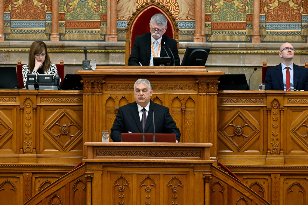 Hungarian Prime Minister Viktor Orban delivers a speech during the first plenary sitting of the spring session of parliament in Budapest, Hungary, Monday, Feb. 23, 2026. Behind the premier is Speaker of the Hungarian Parliament Laszlo Kover. (Zoltan Mathe/MTI via AP)