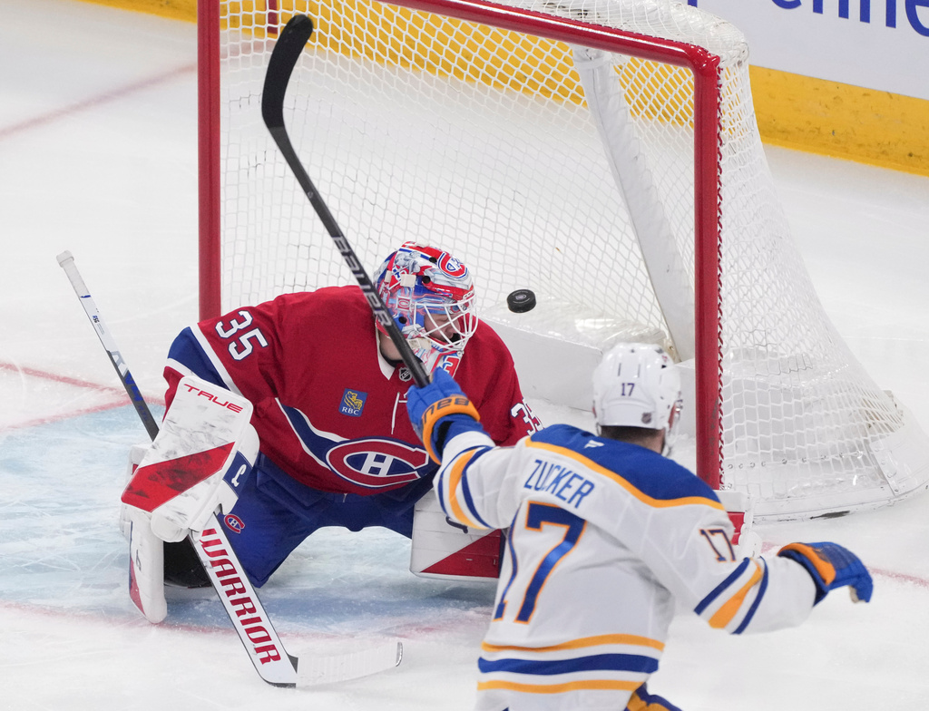 Buffalo Sabres' Jason Zucker (17) scores against Montreal Canadiens goaltender Samuel Montembeault (35) during first-period NHL hockey game action in Montreal, Thursday, Jan. 22, 2026. (Christinne Muschi/The Canadian Press via AP)