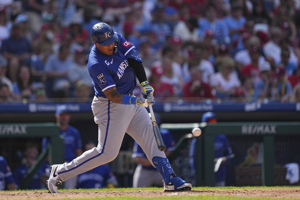 Kansas City Royals' Salvador Perez hits a there-run home run off of Philadelphia Phillies pitcher Aaron Nola during the sixth inning of a baseball game, Sunday, Sept. 14, 2025, in Philadelphia. (AP Photo/Matt Rourke)