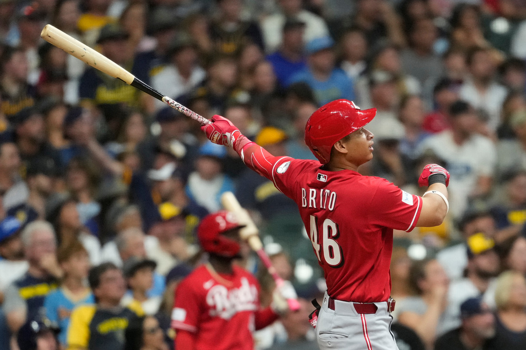 Cincinnati Reds' Juan Brito hits a two-run home run during the fourth inning of a baseball game against the Milwaukee Brewers, Saturday, Sept. 12, 2026, in Milwaukee. (AP Photo/Aaron Gash)