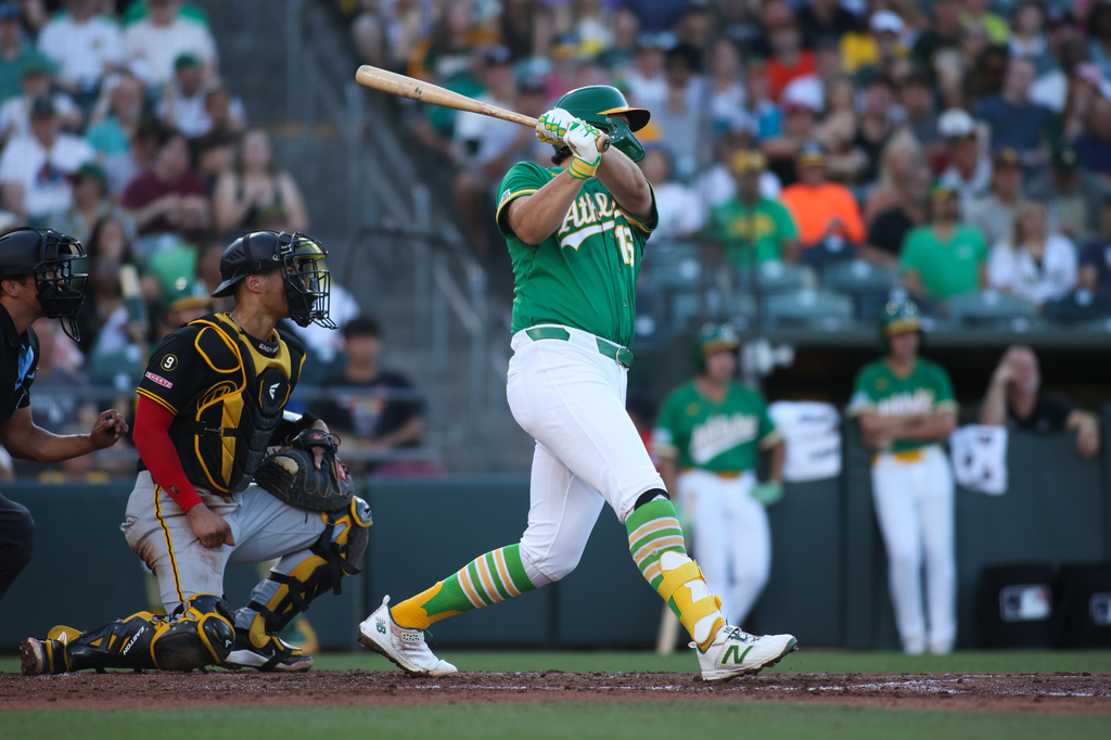 Athletics' Nick Kurtz, right, hits a two-run home run during the second inning of a baseball game against the Pittsburgh Pirates, Monday, June 15, 2026, in West Sacramento, Calif. (AP Photo/Scott Marshall)