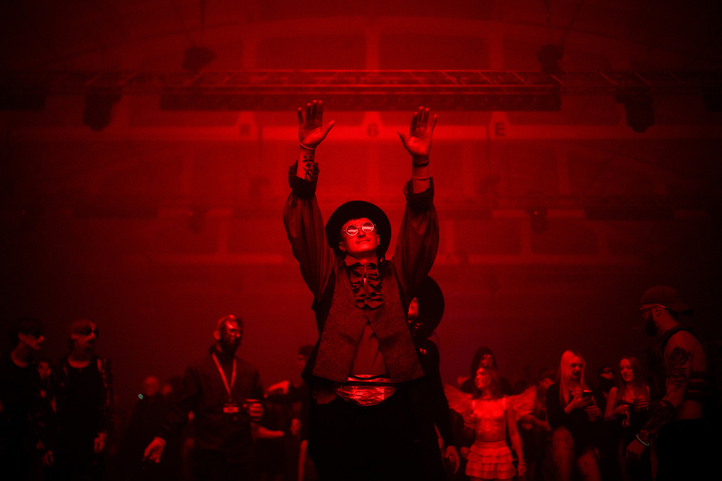 A man in costume dances during a Halloween rave in Kyiv, Ukraine, Saturday, Oct. 25, 2025. (AP Photo/Julia Demaree Nikhinson)