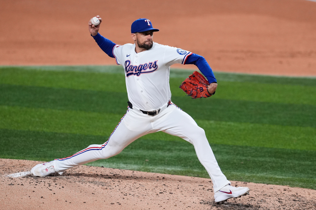 Texas Rangers pitcher Nathan Eovaldi throws to the Seattle Mariners in the fifth inning of a baseball game Tuesday, April 7, 2026, in Arlington, Texas. (AP Photo/Tony Gutierrez)