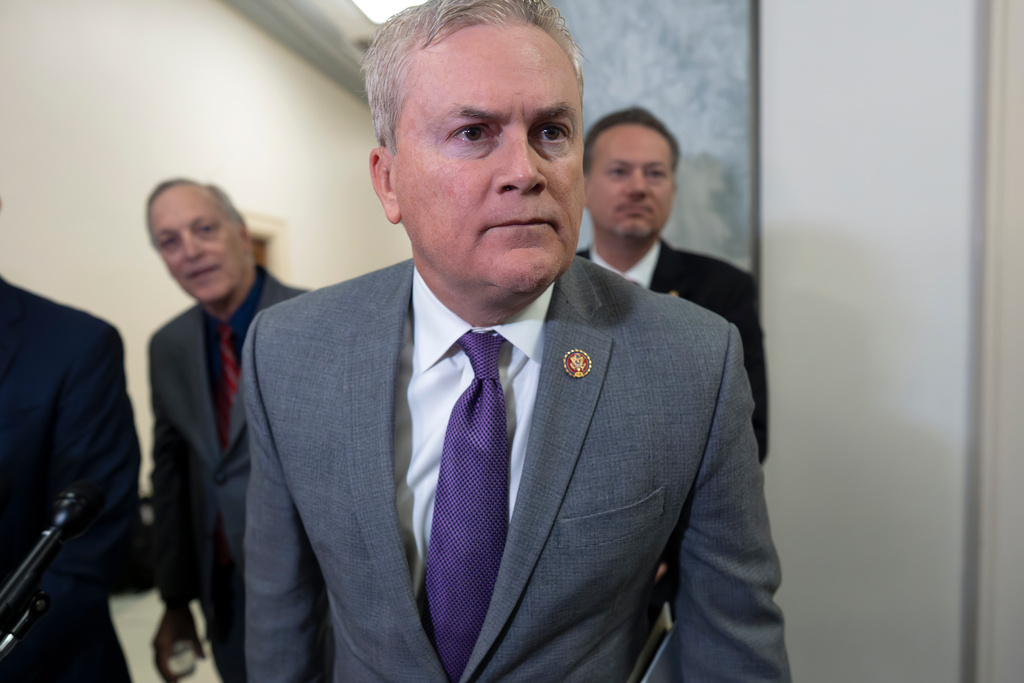 House Oversight Committee Chairman James Comer, R-Ky., leans in to hear a question as he speaks to reporters after former Secretary of State Hillary Clinton did not appear for a deposition as part of the panel's investigation into Jeffrey Epstein and those connected to him, at the Capitol in Washington, Wednesday, Jan. 14, 2026. (AP Photo/J. Scott Applewhite)