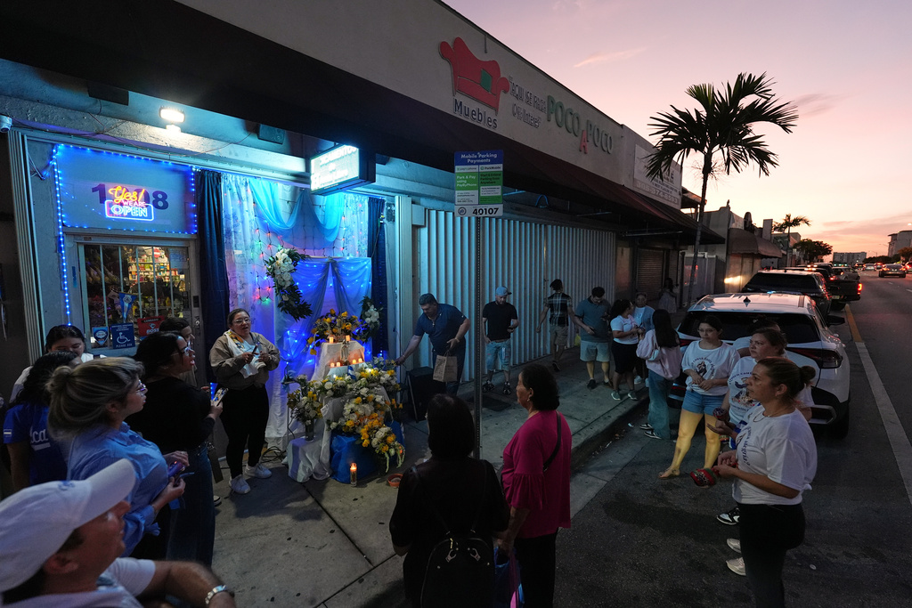 Nicaraguans sing in praise of the Virgin Mary at one of dozens of open-air altars set up near St. John Bosco Catholic Church in celebration of the Dec. 8 feast of the Immaculate Conception, Sunday, Dec. 7, 2025, in Miami. (AP Photo/Rebecca Blackwell)
