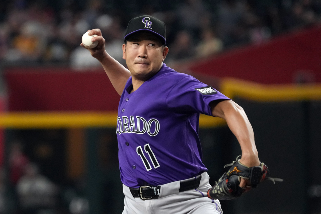 Colorado Rockies pitcher Tomoyuki Sugano throws against the Arizona Diamondbacks in the first inning of a baseball game, Tuesday, Aug. 11, 2026, in Phoenix. (AP Photo/Rick Scuteri)