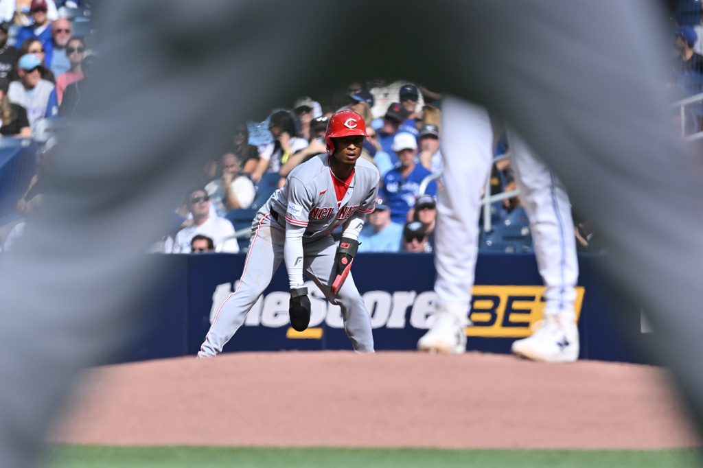 Cincinnati Reds' Carlos Jorge (38) takes a lead off first base against the Toronto Blue Jays during the first inning of a baseball game in Toronto, Saturday, Sept. 26, 2026. (Jon Blacker/The Canadian Press via AP)