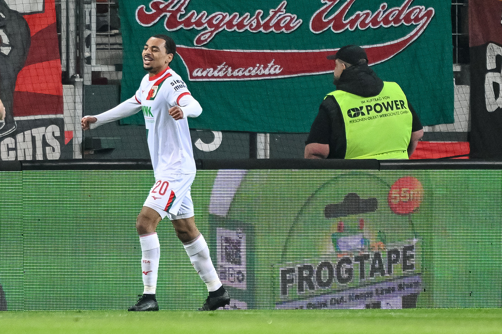 Augsburg's Alexis Claude-Maurice celebrates after scoring during the German Bundesliga soccer match between FC Augsburg and TSG 1899 Hoffenheim in Augsburg, Germany, Friday, April 10, 2026. (Harry Langer/dpa via AP)