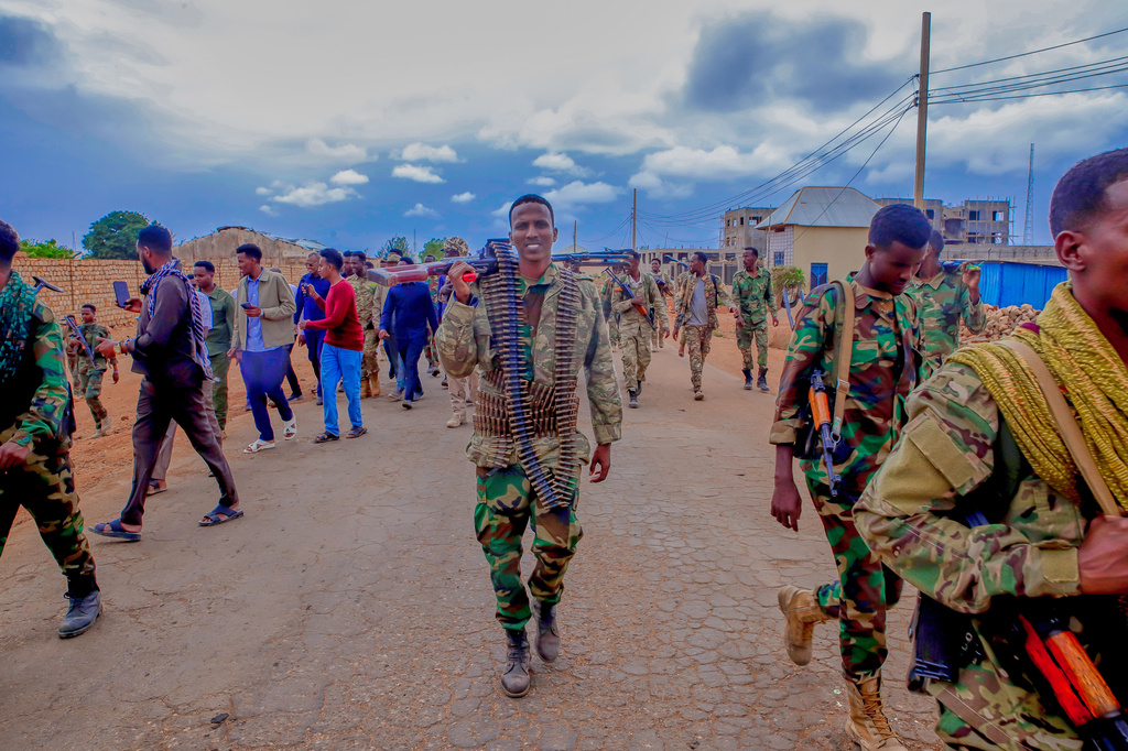 Government troops patrol alongside government officials after clashes with militias that killed dozens of people, including civilians, in Baidoa, Somalia, Monday, Aug. 17, 2026. (AP Photo/Farah Abdi Warsameh)
