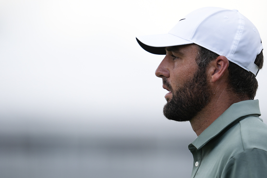 Scottie Scheffler walks on the 16th hole during the final round of the Tour Championship golf tournament, Sunday, Aug. 24, 2025, in Atlanta. (AP Photo/Mike Stewart)