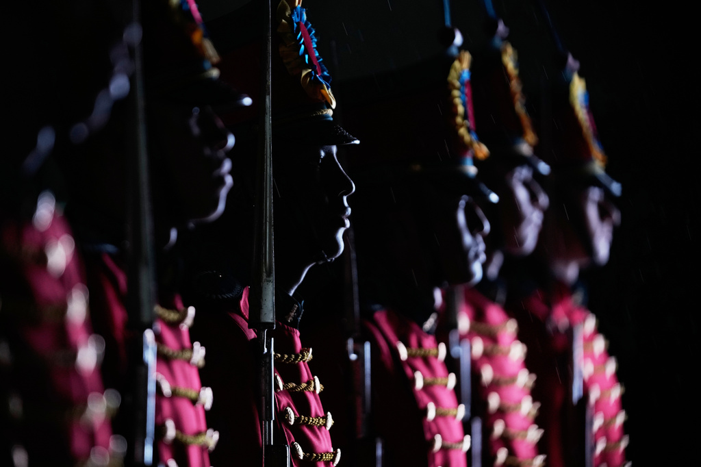 Soldiers stand in formation during a vigil in memory of the victims of a military cargo plane crash in Puerto Leguizamo, at the Monument to the Fallen Heroes in Bogota, Colombia, Wednesday, March 25, 2026. (AP Photo/Fernando Vergara)