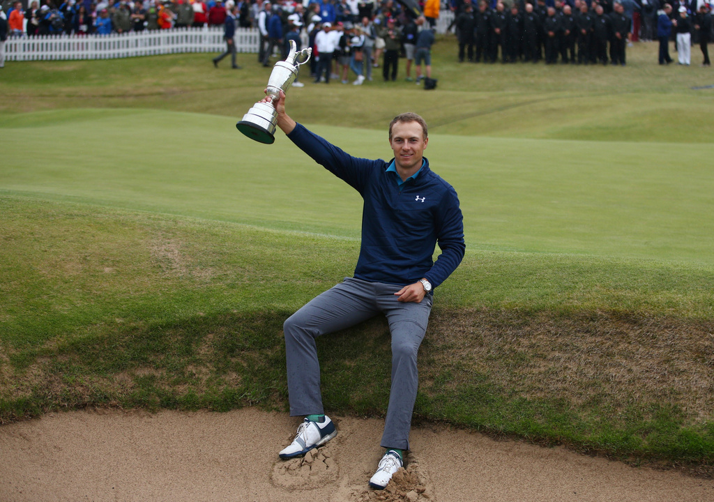 FILE - Jordan Spieth of the United States holds the trophy after winning the British Open Golf Championships at Royal Birkdale, Southport, England, July 23, 2017. (AP Photo/Dave Thompson, File)