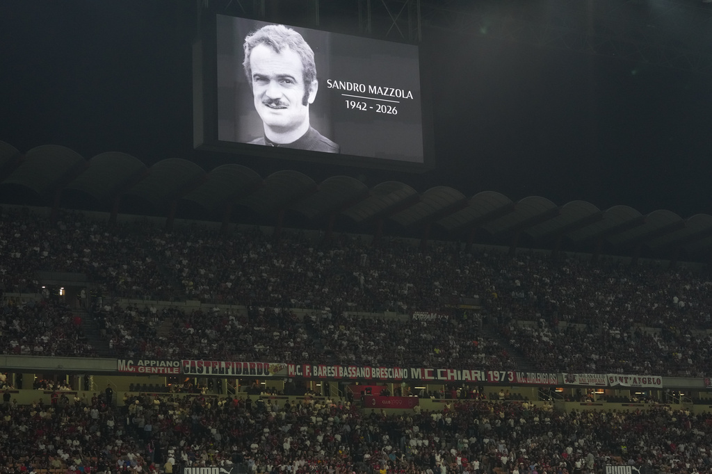 A portrait of late Sandro Mazzola is displayed moment of silence before the Serie A soccer match between AC Milan and Lecce, in Milan, Italy, Sunday, Sept. 20, 2026. (AP Photo/Antonio Calanni)