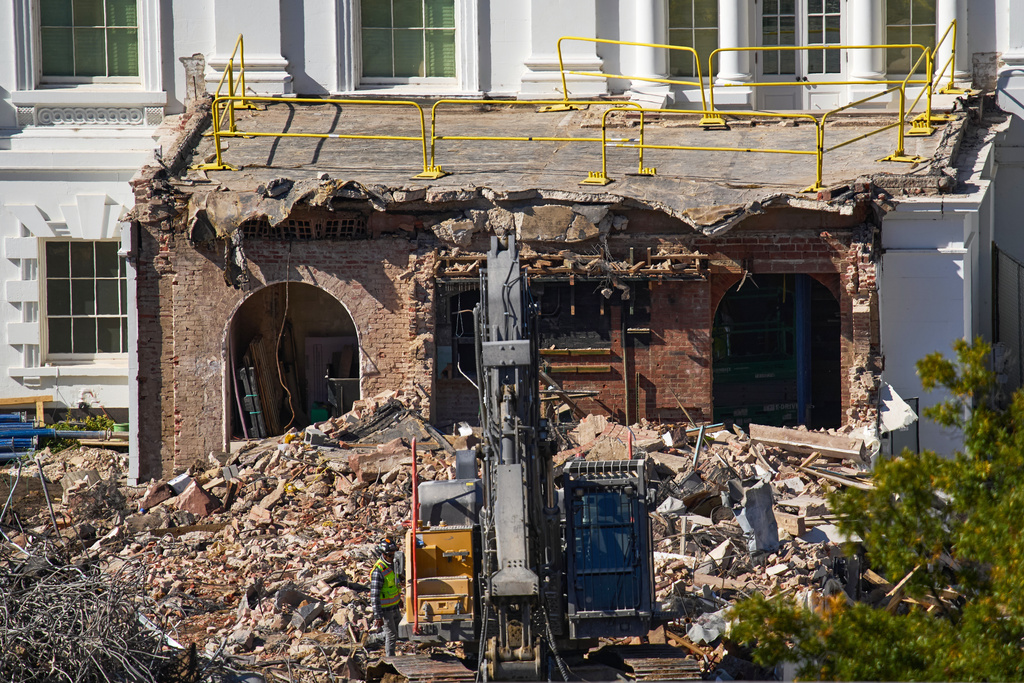 FILE - A worker walks among debris from a largely demolished part of the East Wing of the White House, Oct. 23, 2025, in Washington, before construction of a new ballroom. (AP Photo/Jacquelyn Martin)