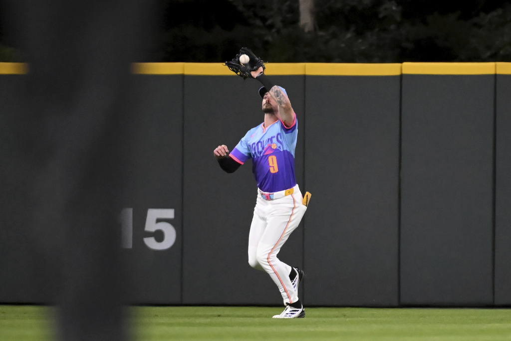 Colorado Rockies center fielder Brenton Doyle catches a sacrifice fly in the fifth inning of a baseball game against the Los Angeles Angels Friday, Sept. 19, 2025, in Denver. (AP Photo/Geneva Heffernan)