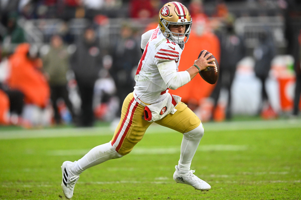 San Francisco 49ers quarterback Brock Purdy rolls out against the Cleveland Browns during the second half of an NFL football game, Sunday, Nov. 30, 2025, in Cleveland. (AP Photo/David Richard)