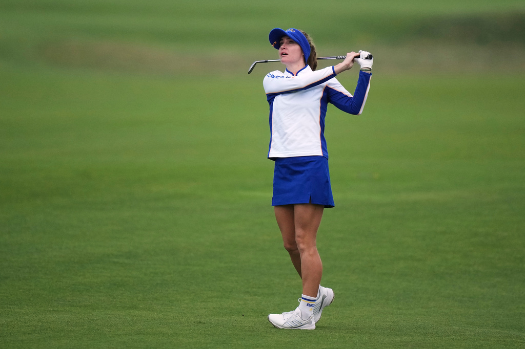 Charley Hull of Europe watches her approach shot into the second green during the Solheim Cup at the Bernardus Golf course in Den Bosch, Netherlands, Friday, Sept. 11, 2026. (AP Photo/Alastair Grant)