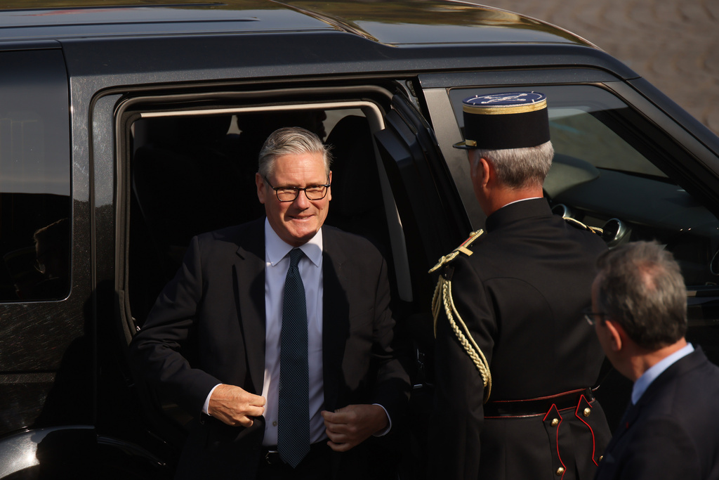 British Prime Minister Keir Starmer arrives for the Bastille Day military parade on the Champs-Elysees avenue in Paris, Tuesday, July 14, 2026. (AP Photo/Thomas Padilla)